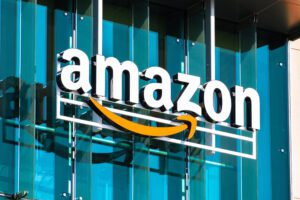 Feature Image for Digital Disruption Blog, image of Amazon logo on the side of an office building