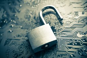 Feature Image for Security and Compliance in the Cloud Blog, a lock sits on a circuit board