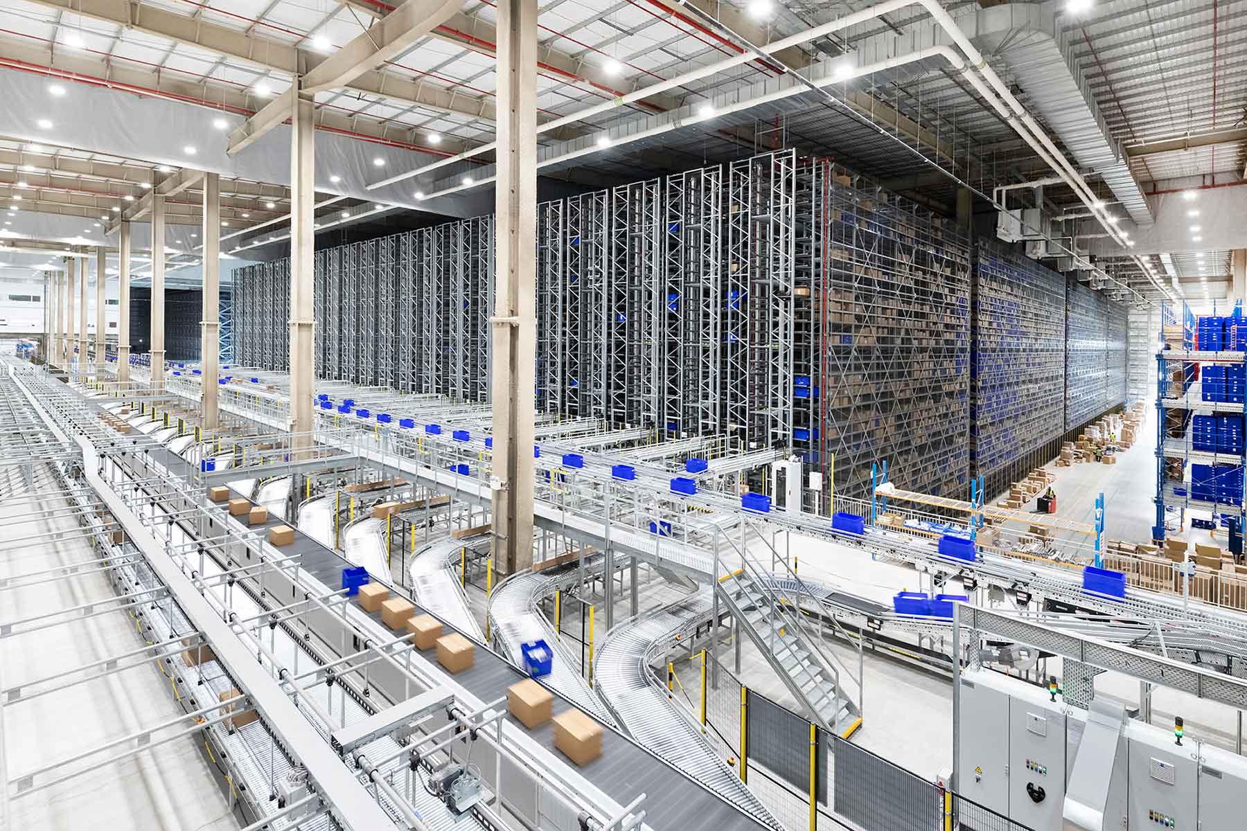 Dematic case study header image: of a dematic warehouse with boxes being sorted and stored