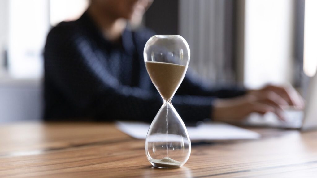 The Future of Microsoft GP for Your Business Feature Image: Close up view of hourglass measuring time on wooden table