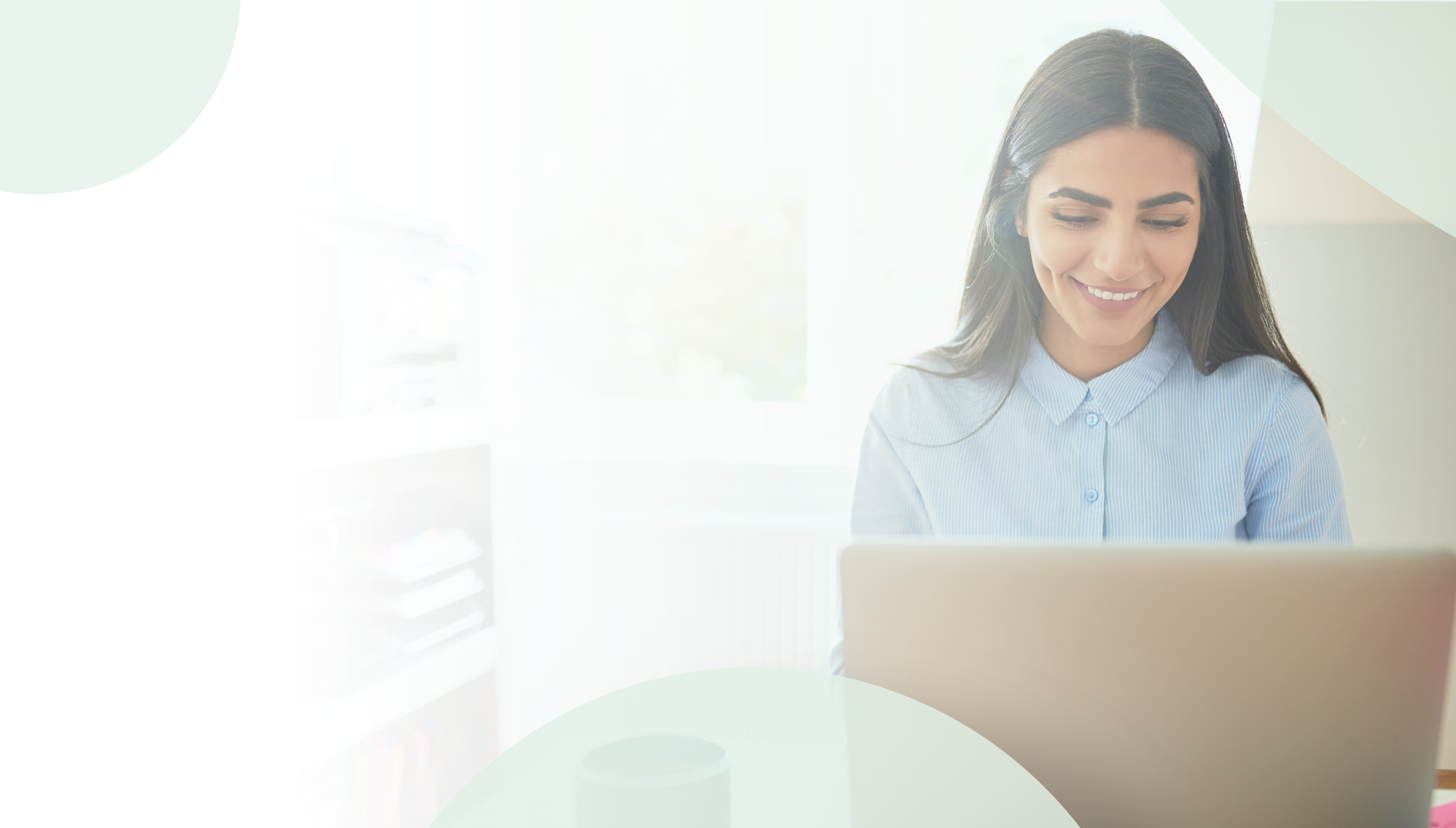 No Code / Low Code Application Modernization on Azure and Power Apps Header Image: A woman works happily on her computer in her office