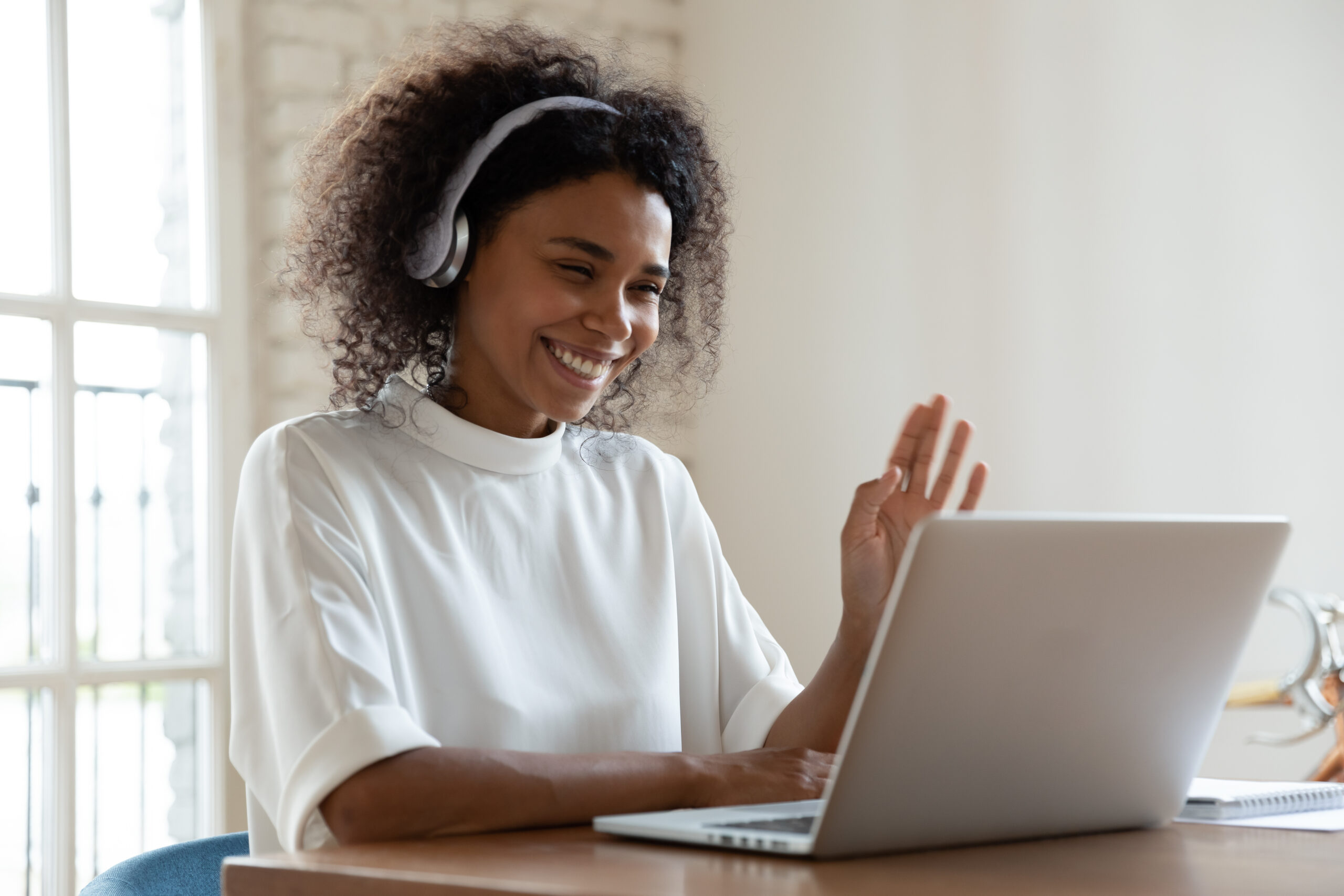 Data Analytics Consulting, a black woman joins her monthly call with her client to provide recommendations on data, data managed services