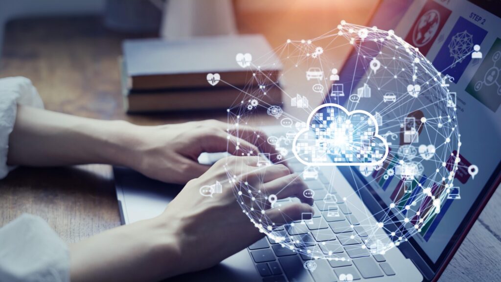 feature image: a person's hands hover over the keyboard, with an overlay of connected icons to represent the different components of a Cloud ERP system