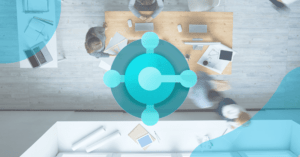 Birds eye view angle image of professionals sat around a meeting desk. Business central logo is overlayed.