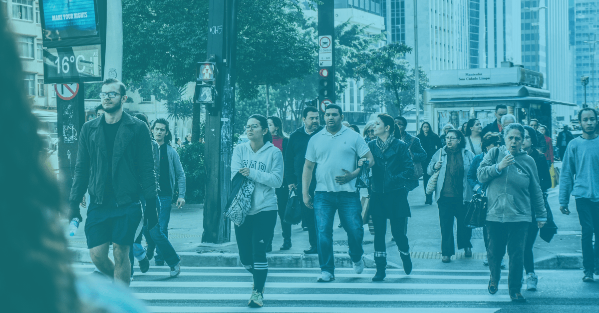 PowerGov Event Feature Image - Citizens walk along a busy city street