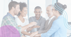A team of colleagues puts their hands in the center of their group in celebration of an accomplishment. Event Feature Image - emPerform and HR.com, Modernizing Performance Reviews So They Actually Work