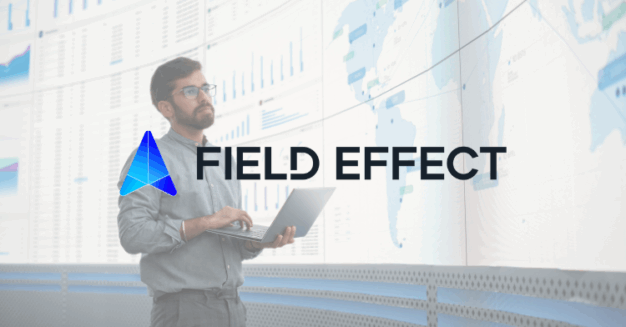 Field Effect Business Central Case Study Feature Image - professional holds computer and analyze screen of data and charts