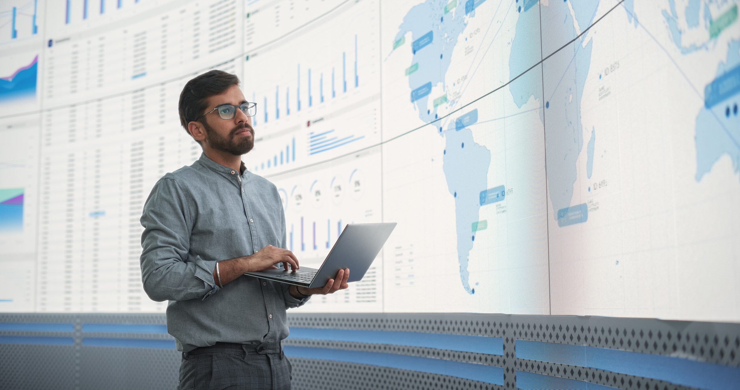 Field Effect Business Central Case Study Feature Image - professional holds computer and analyze screen of data and charts