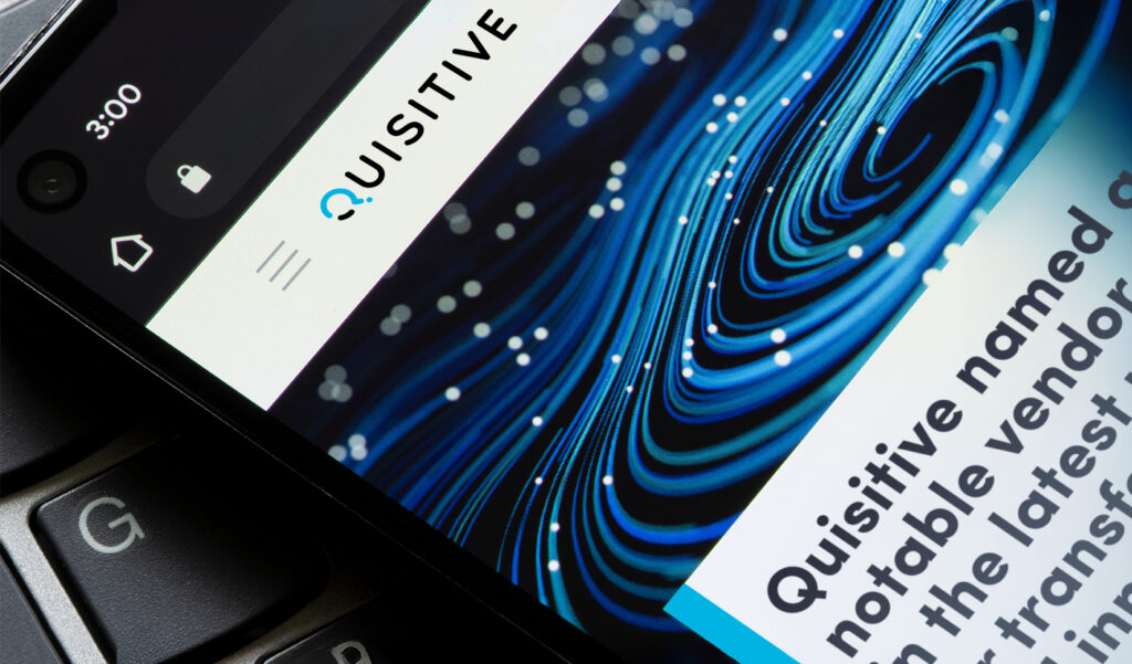 Computer screen with mock up of Quisitive Gartner Magic Quadrant article on screen