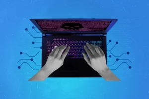 Graphic hands on a laptop, laptop screen shows an evil emoji to represent bad actors and cyber threats. Blog feature image - Five Eyes alliance warning on AI security risk and the compressed cyber-attack timeline.