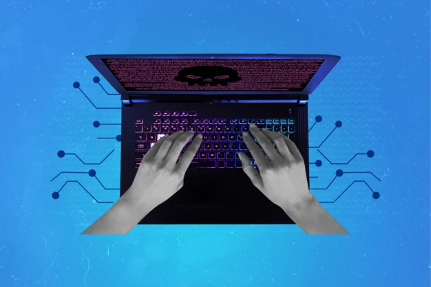 Graphic hands on a laptop, laptop screen shows an evil emoji to represent bad actors and cyber threats. Blog feature image - Five Eyes alliance warning on AI security risk and the compressed cyber-attack timeline.